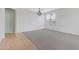 Bright living space features neutral walls, carpet, and tiled flooring, ideal for versatile decor options at 1358 E Angie St, Casa Grande, AZ 85122