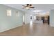 Expansive living area with tile flooring leads to a well-equipped kitchen, offering a seamless, flowing layout at 1358 E Angie St, Casa Grande, AZ 85122