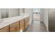 Bright bathroom features double vanity with wood cabinets, neutral countertops, and walk-in shower at 13769 W Whisper Rock Trl, Peoria, AZ 85383