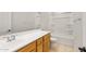 Bright bathroom with a long vanity, large mirror, and tub/shower combo at 13769 W Whisper Rock Trl, Peoria, AZ 85383