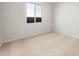 Bright bedroom with neutral carpet, large window, and fresh white walls at 13769 W Whisper Rock Trl, Peoria, AZ 85383