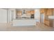 Bright kitchen featuring an island with granite countertops, stainless steel appliances, and wooden cabinets at 13769 W Whisper Rock Trl, Peoria, AZ 85383