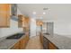 A gourmet kitchen showcases granite countertops, stainless steel appliances, and abundant wooden cabinet space at 13769 W Whisper Rock Trl, Peoria, AZ 85383