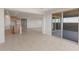 This open-concept space features a stylish kitchen and a living room with a sliding glass door at 13769 W Whisper Rock Trl, Peoria, AZ 85383