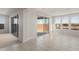 A sunny, open living room includes lots of natural light and a sliding glass door to an outdoor area at 13769 W Whisper Rock Trl, Peoria, AZ 85383