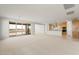 Expansive open-concept living space adjacent to the kitchen, featuring large windows and sliding doors at 13769 W Whisper Rock Trl, Peoria, AZ 85383