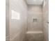 Walk-in shower features gray tile and bench at 13769 W Whisper Rock Trl, Peoria, AZ 85383