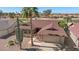 Aerial view of property with mature trees and desert landscaping near a golf course at 1435 Leisure World --, Mesa, AZ 85206