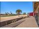Scenic backyard featuring a paved patio, well-maintained landscaping, and views of the golf course at 1435 Leisure World --, Mesa, AZ 85206