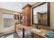 Elegant bathroom featuring granite countertops, double sinks, wood cabinets and modern fixtures at 1435 Leisure World --, Mesa, AZ 85206