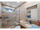 Upgraded bathroom featuring a glass shower, granite countertop, and custom tile work at 1435 Leisure World --, Mesa, AZ 85206