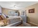 Comfortable bedroom with a ceiling fan, soft textures, and natural light from the window at 1435 Leisure World --, Mesa, AZ 85206