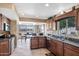 Well-lit kitchen with granite countertops, stainless steel appliances, and a view of the outdoor dining area at 1435 Leisure World --, Mesa, AZ 85206