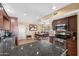 Functional kitchen featuring granite countertops, stainless steel appliances, and ample cabinet space at 1435 Leisure World --, Mesa, AZ 85206
