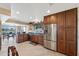 Modern kitchen featuring stainless steel appliances, wood cabinets, and granite countertops at 1435 Leisure World --, Mesa, AZ 85206
