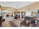 Open-concept living room featuring tile flooring, dining area, and neutral color palette at 1435 Leisure World --, Mesa, AZ 85206