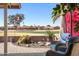 Cozy outdoor patio with comfortable seating and views of the well-maintained golf course at 1435 Leisure World --, Mesa, AZ 85206