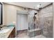 Upgraded bathroom shower with attractive tile, a built in bench, and modern fixtures at 1435 Leisure World --, Mesa, AZ 85206
