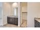 Bathroom featuring dual sinks with granite countertop and walk-in closet at 15032 W Gray Fox Trl, Surprise, AZ 85387