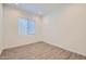 Bedroom with neutral-toned walls, plush carpet, and ample natural light from window at 15032 W Gray Fox Trl, Surprise, AZ 85387