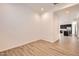 Flex room with wood-look tile flooring, natural light, and neutral color palette at 15032 W Gray Fox Trl, Surprise, AZ 85387