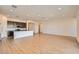Open concept living room next to kitchen, with tile floors and recessed lighting at 15032 W Gray Fox Trl, Surprise, AZ 85387