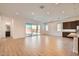 Open living space with sliding glass doors leading to outdoor patio at 15032 W Gray Fox Trl, Surprise, AZ 85387