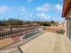 Back porch featuring iron fencing and views of the desert landscape and mountains at 15420 S 29Th St, Phoenix, AZ 85048