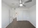 Bedroom with neutral carpet, ceiling fan, and closet with sliding doors at 15420 S 29Th St, Phoenix, AZ 85048