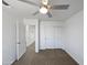 Neutral-toned bedroom features a ceiling fan, and closet with sliding doors at 15420 S 29Th St, Phoenix, AZ 85048