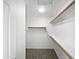 Spacious walk-in closet with wooden shelves and carpeted floor at 15420 S 29Th St, Phoenix, AZ 85048