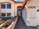Inviting home entrance with brick walkway, desert landscaping, and covered entryway at 15420 S 29Th St, Phoenix, AZ 85048