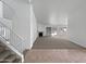 Bright living room features a fireplace, a staircase, and sliding glass doors leading to a private backyard pool at 15420 S 29Th St, Phoenix, AZ 85048