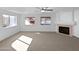 Bright living room with views of the pool, a fireplace, and lots of natural light at 15420 S 29Th St, Phoenix, AZ 85048