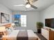 Comfortable main bedroom with a large window, ceiling fan, and neutral decor at 15420 S 29Th St, Phoenix, AZ 85048