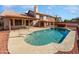 Backyard pool with a patio area, a hot tub, a tiled roof structure and desert landscaping at 15420 S 29Th St, Phoenix, AZ 85048