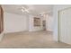 Bedroom with neutral carpet and white walls, framed windows with wooden shutters and ceiling fan at 15576 W Yucatan Dr, Surprise, AZ 85379