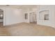 Spacious living room with neutral carpet and recessed lighting at 15576 W Yucatan Dr, Surprise, AZ 85379