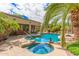 Gorgeous pool and spa with lush landscaping, perfect for enjoying sunny days and outdoor living at 15576 W Yucatan Dr, Surprise, AZ 85379