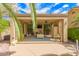 Backyard poolside cabana offers the ultimate outdoor living, with a TV and comfortable lounge area at 15576 W Yucatan Dr, Surprise, AZ 85379