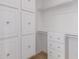 Spacious walk-in closet with built-in shelving and drawers for storage and organization at 15576 W Yucatan Dr, Surprise, AZ 85379