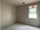 Bedroom under construction featuring a window that fills the space with natural light, ready for personalization at 15768 W Beryl Ave, Waddell, AZ 85355