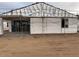 The exterior of a home being built, showing insulation materials and scaffolding at 15768 W Beryl Ave, Waddell, AZ 85355