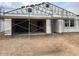 Unfinished exterior of a home with an attached two-car garage, showcasing the building's construction phase at 15768 W Beryl Ave, Waddell, AZ 85355