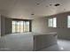 Spacious living room under construction with large sliding glass doors and multiple windows, promoting an airy atmosphere at 15768 W Beryl Ave, Waddell, AZ 85355