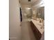 Bathroom with a glass door shower, a sink with a vanity, and a mirror at 1652 W Campbell Ave, Phoenix, AZ 85015
