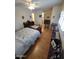 Bedroom with a decorative ceiling fan, dresser, and a bookshelf at 1652 W Campbell Ave, Phoenix, AZ 85015