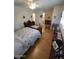 Bedroom with a decorative ceiling fan, dresser, and a bookshelf at 1652 W Campbell Ave, Phoenix, AZ 85015