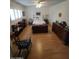 Bedroom with a decorative ceiling fan, dresser, and a bookshelf at 1652 W Campbell Ave, Phoenix, AZ 85015