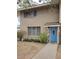 Two-story home with a blue front door, well-maintained landscaping, and large windows at 1652 W Campbell Ave, Phoenix, AZ 85015